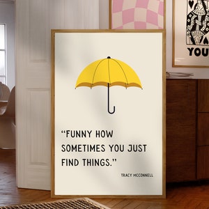 May include: A yellow umbrella with a white background and the quote "FUNNY HOW SOMETIMES YOU JUST FIND THINGS." by Tracy McConnell.