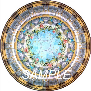 May include: A circular stained glass window with a blue and white background. The window features a floral design with pink roses and green leaves. The window is surrounded by a gold frame with a gray and white pattern.