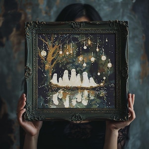 May include: A framed cross-stitch artwork depicting a spooky scene with white ghosts, a tree, and glowing orbs. The artwork is set against a dark background, with a reflection of the ghosts in the water. The frame is dark green.