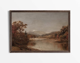 Könnte beinhalten: Gerahmtes Landschaftsgemälde, das eine ruhige See mit herbstlichen Bäumen zeigt. Das Kunstwerk ist in einem dunkelbraunen Holzrahmen gefasst. Die Farbgebung umfasst Braun-, Orange- und Grautöne, mit Bergen im Hintergrund.