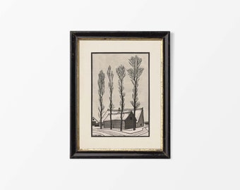 May include: A black and white woodcut print of a house with a thatched roof and three bare trees in front of it. The print is framed in a black frame with a gold mat.