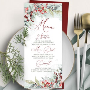 May include: A menu card with a watercolor design featuring red berries and green leaves. The menu is displayed on a white plate with gold and white silverware. The menu includes the words "Menu", "Starter", "Main Dish", and "Dessert".