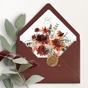 May include: A burgundy envelope with a floral design and gold wax seal. The envelope's interior features a watercolor bouquet of red, orange, and cream flowers. The text "S&O" and the date "28.09.2028" are printed on the interior.