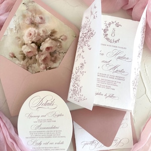 May include: A set of wedding stationery in pink hues. The suite includes an invitation, details card, and envelopes. The invitation features floral designs and the names "en Hudson and Martin". The details card provides ceremony and reception information.