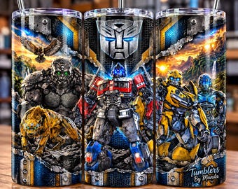May include: A cylindrical metal tumbler with a straw featuring a full-wrap graphic of Transformers characters including Optimus Prime, Bumblebee, and a gorilla, set against a landscape background with the Autobot logo and the text Tumblers by Manda.