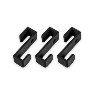 May include: Three black plastic hooks, each with a rounded top and a rectangular base. The hooks are arranged in a row, with the bases facing the viewer.