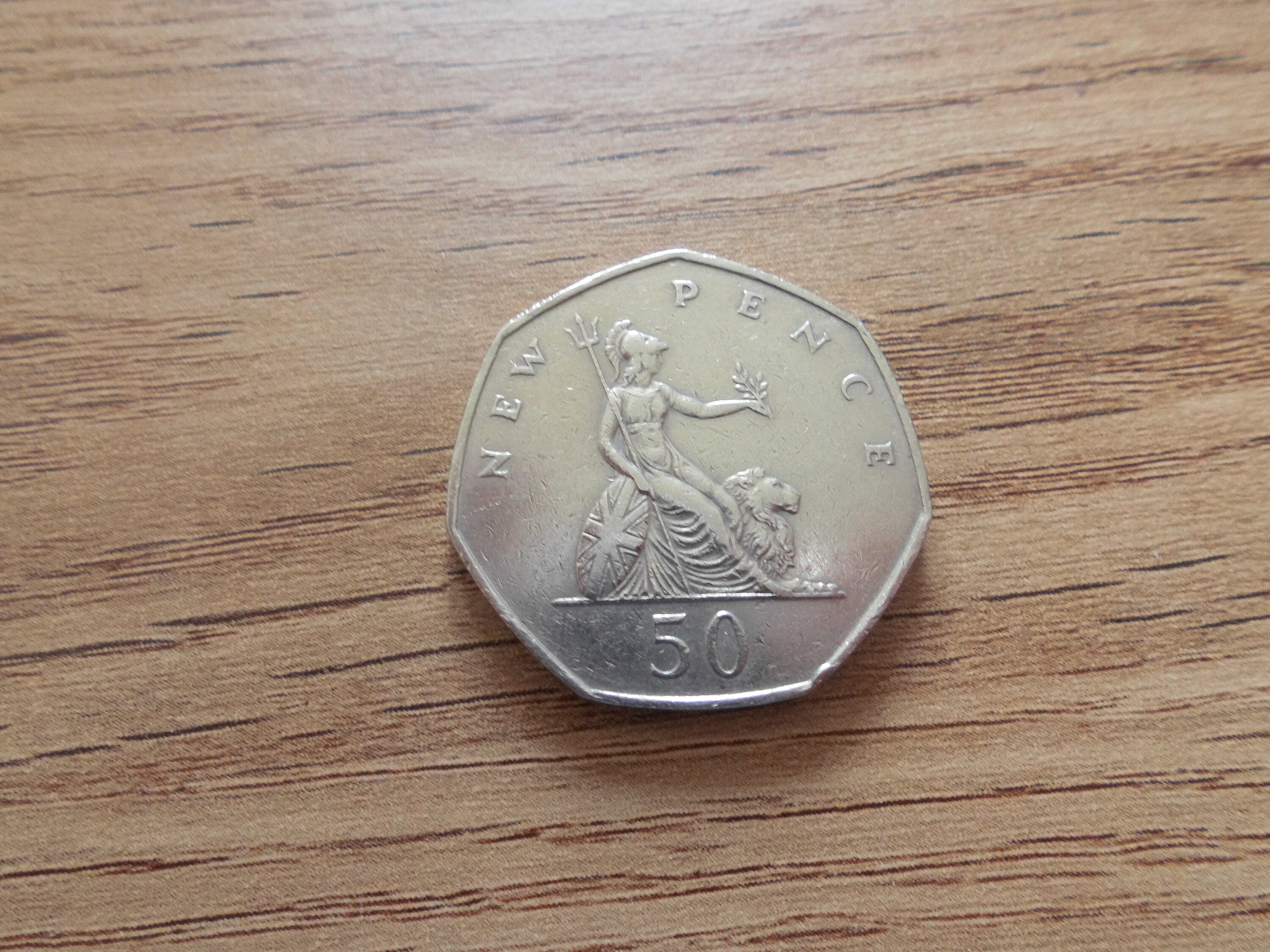 swimming-50p-coin-value-2016-discounts-shops-nationaldefensepac