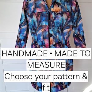 May include: A hooded jacket featuring a vibrant blue, purple, and orange abstract floral pattern with a front zipper closure. The text on the image reads: HANDMADE • MADE TO MEASURE Choose your pattern & fit. The jacket is displayed on a mannequin.