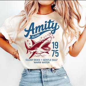 Amity Island 1975 Shirt, Jaws 50th Anniversary Tee, Great White Shark Horror Movie Shirt, Retro Thriller Beach T-Shirt, Shark Week Fan Gift