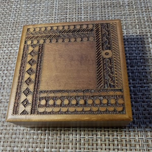 Vintage Carved Wood Trinket Box with fine gold or brass detail.