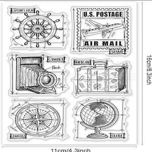 May include: A set of six clear rubber stamps with various travel-themed designs, including a captain's wheel, an airplane, a camera, a suitcase, a compass, and a globe. The stamps are 6.3 inches tall and 4.3 inches wide.