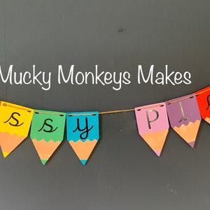 May include: A colorful pencil-shaped banner that reads "Mucky Monkeys Makes Messy Play".