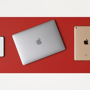 Red faux leather desk mat under a laptop and tablet