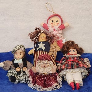 Small Porcelain Dolls and Doll Ornaments Including God Bless America Sitting Doll in Polka Dot Dress Small Porcelain Boy or Red Boots Doll