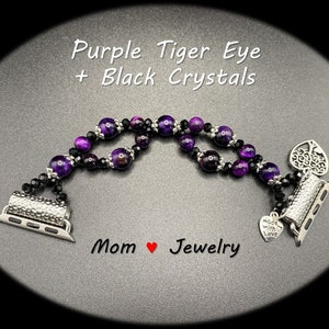 May include: Purple tiger eye and black crystal beaded Apple Watch band with a silver tree of life charm and a silver charm that says "Made with Love".