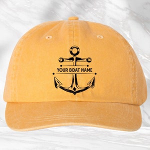 May include: A yellow baseball cap with a black anchor and the text "YOUR BOAT NAME" on the front.