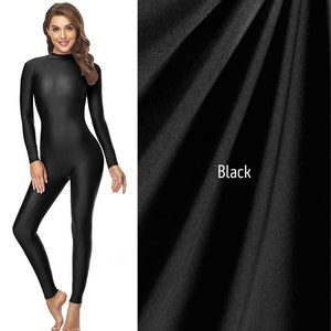 May include: Black long-sleeved bodysuit with a mock neck. The bodysuit is made of a stretchy, smooth fabric.