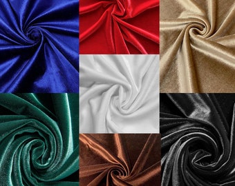 May include: A collage of velvet fabric swatches in various colors. The colors include royal blue, red, white, gold, emerald green, brown, and black. Each swatch is swirled to show the fabric's texture and sheen.