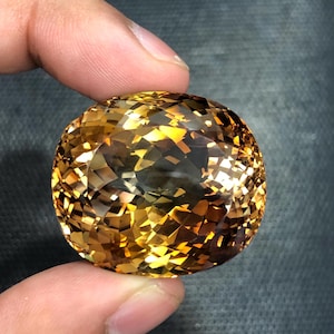 194 Carat Brown Topaz Gemstone: Oval Cut, Pakistan