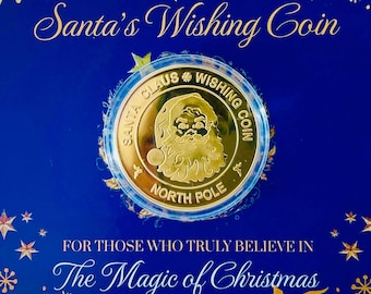May include: A gold-colored coin featuring Santa Claus, set on a blue card with gold accents. The card reads "Santa's Wishing Coin" and "The Magic of Christmas". The coin is a festive item.