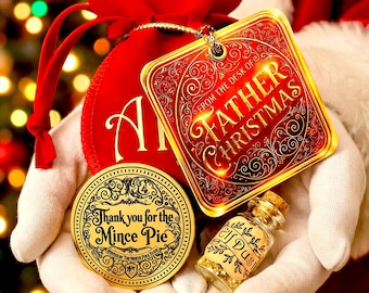 May include: A red velvet drawstring bag with a gold-bordered square tag reading From the Desk of Father Christmas, a round gold coin reading Thank you for the Mince Pie, and a small glass bottle with a cork stopper labeled Elf Dust.