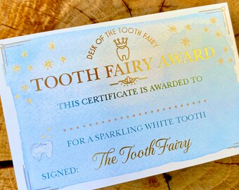 May include: A blue and gold certificate with the text "Tooth Fairy Award" and "This certificate is awarded to... for a sparkling white tooth." The certificate is signed "The Tooth Fairy".