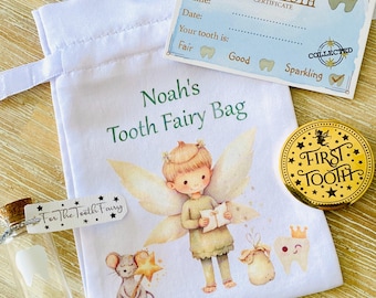 May include: A white tooth fairy bag with a green inscription that reads "Noah's Tooth Fairy Bag". The bag features a whimsical illustration of a tooth fairy with wings, holding a book. A small glass vial with a tooth inside and a gold coin with the inscription "First Tooth" are also visible.