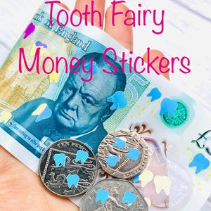 May include: A hand holding British banknotes and coins decorated with blue tooth-shaped stickers. The text "Tooth Fairy Money Stickers" is written in pink. The coins are marked with the words "Ten Pence" and "Twenty Pence".