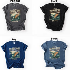 four different t-shirt designs featuring the historic Columbia River Highway in Oregon. The t-shirts are arranged in a 2x2 grid, with each design showcasing a different color and style.