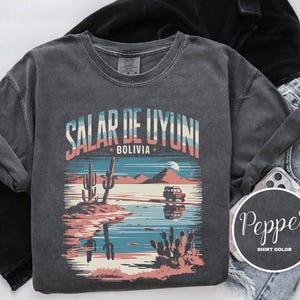 a t - shirt with a desert scene on it