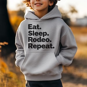 Kids Rodeo Hoodie - Eat Sleep Rodeo Repeat Youth Sweatshirt - Cowboy Cowgirl Gift - Youth Western Hoodie - Rodeo Life Shirt