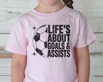Kids Soccer Shirt - Soccer  Player Gift - Life's About Goals and Assists - Youth Soccer Tee - Girls Game Day Shirt - Boys Sports Shirt