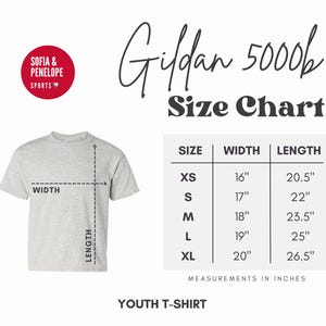 May include: A light gray youth t-shirt with a size chart. The chart lists sizes XS to XL, with corresponding width and length measurements in inches. The text "Gildan 5000b" and "Sofia & Penelope Sports" are also visible.