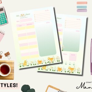 May include: Two daily planner pads with a floral and chick design. The pads have sections for to-do lists, notes, and schedules. The words "Daily Planner" and "Crafty Mandy" are visible.