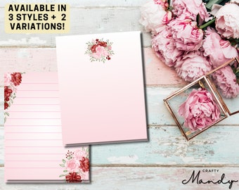 May include: Two pink and white floral stationery notepads with lined and blank pages. The notepads feature a floral design with burgundy and pink flowers. The text "AVAILABLE IN 3 STYLES + 2 VARIATIONS!" is at the top of the image.