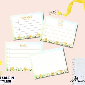 May include: Four square notepads with pastel blue and green borders. Each notepad has a different design: "Reminder", "To do:", "Let's do this!", and a dotted page. The bottom of each notepad features a floral and chick design. The text "AVAILABLE IN 6 STYLES!" is visible.