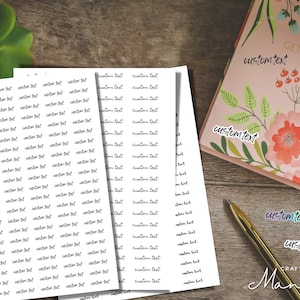 May include: Three sheets of white paper with the text "custom text" repeated in black cursive writing. The sheets are on a wooden surface with a pink notebook with floral designs and the text "custom text" and "GET IT DONE" on the cover. A gold pen is lying on the surface.