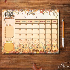 May include: A printable monthly planner with a fall theme. The planner has a brown background with a floral design and the words "Hello Autumn" at the top. The planner has a to-do list, notes section, and a calendar with the days of the week labeled.