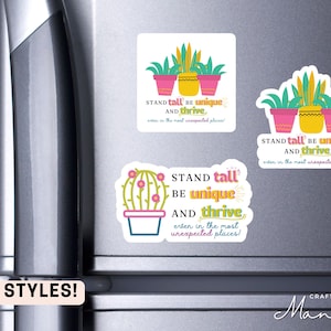 May include: Three styles of fridge magnets with a motivational quote: "Stand tall, be unique, and thrive, even in the most unexpected places!" Each magnet features a different potted plant with pink and green accents.