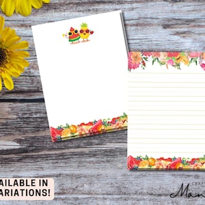 May include: Two white notepads with colourful fruit and floral designs. One notepad features a watermelon and pineapple graphic, while the other has a floral top border and lined pages. The text "AVAILABLE IN 4 VARIATIONS!" is at the bottom.