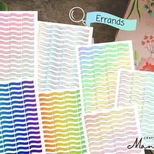 May include: A set of colorful, gradient-filled banner stickers with the word "Errands" written on a banner at the top. The stickers are designed for use in a planner or journal.