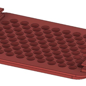 May include: A reddish-brown rectangular tray with numerous small, evenly spaced circular holes. The tray has raised edges and two rectangular protrusions on the sides. The design suggests a specialized container for organizing small items.