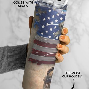 May include: A stainless steel tumbler with a distressed American flag design and the words "REMEMBER" and "HERO" on it. The tumbler comes with a straw and fits most cup holders.