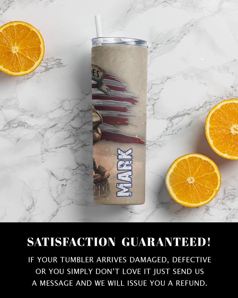 May include: A stainless steel tumbler with a patriotic design featuring a torn American flag and the word "MARK" printed on the side. The tumbler is on a white marble surface with oranges.
