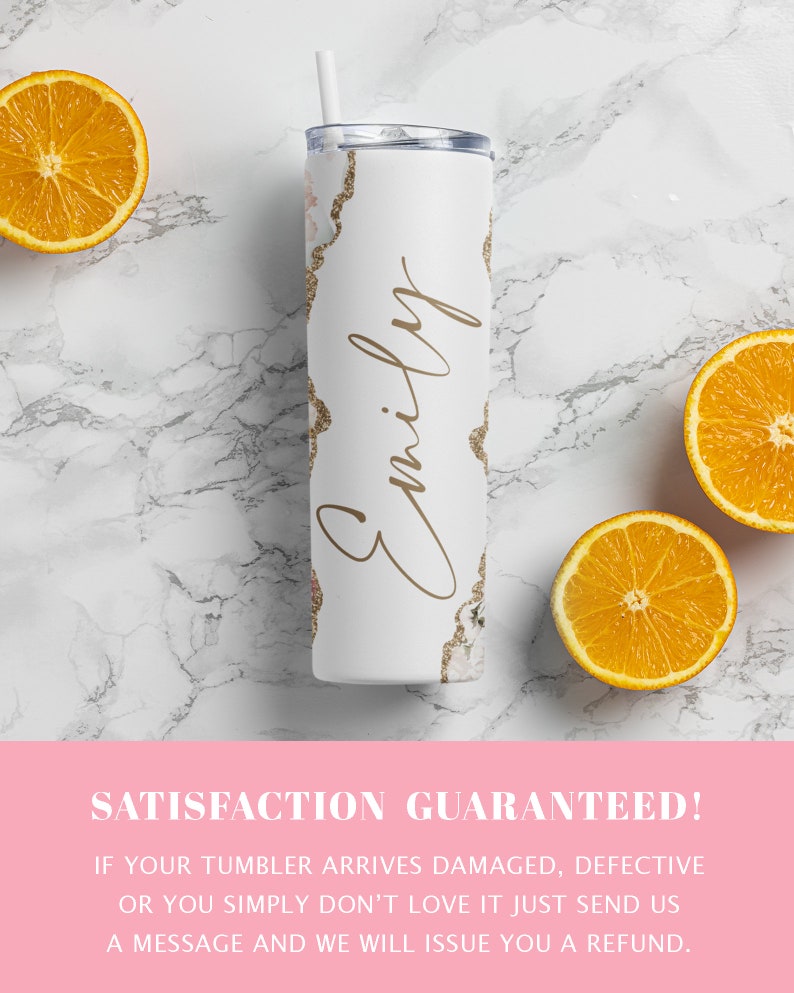 May include: White stainless steel tumbler with a gold glitter design and the name "Emily" written in cursive. The tumbler is sitting on a white marble surface with three orange slices.