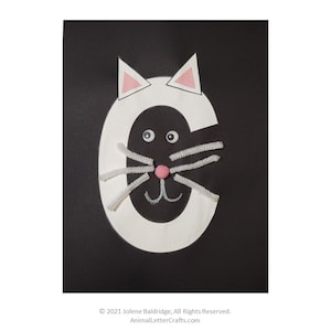 May include: White letter C with a black cat face. The cat has pink ears, white whiskers, and black eyes.