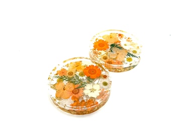 Oranje bloemenonderzetter