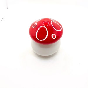 White and red mushroom jar