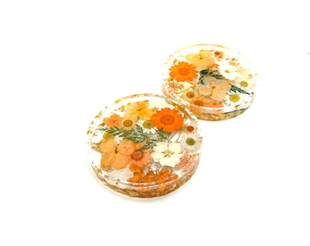 Gebloemde onderzetters oranje geperste bloemen