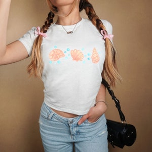 Seashell Baby Tee Coquette Baby Tee Womens Baby Tee Ocean Animal Baby Tee Trendy Shirts Baby Tee Seashell Shirt Vintage 1970s Baby Tee